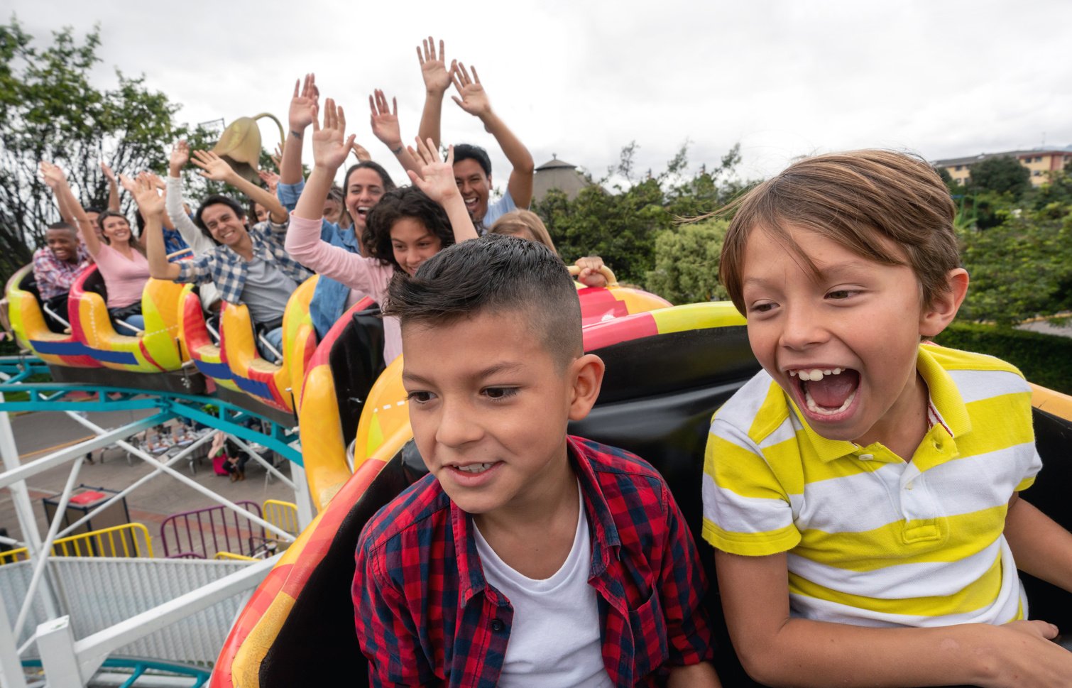 Happy kids having fun in an amusement park